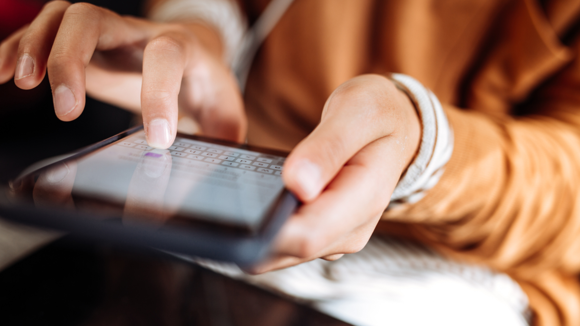 Person scrolling on a mobile device