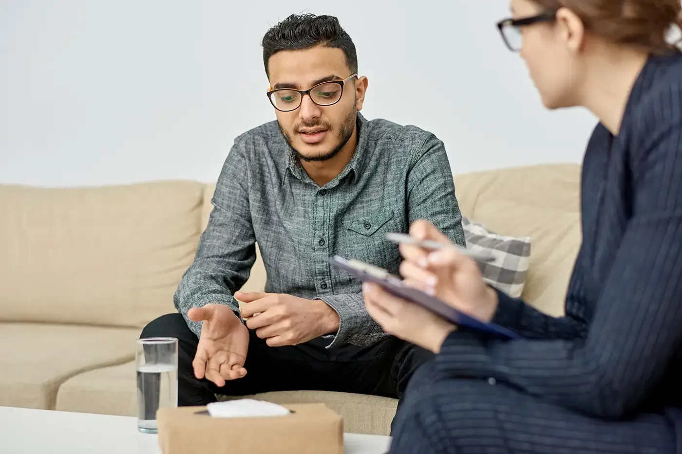 Young man meeting with a counselor.