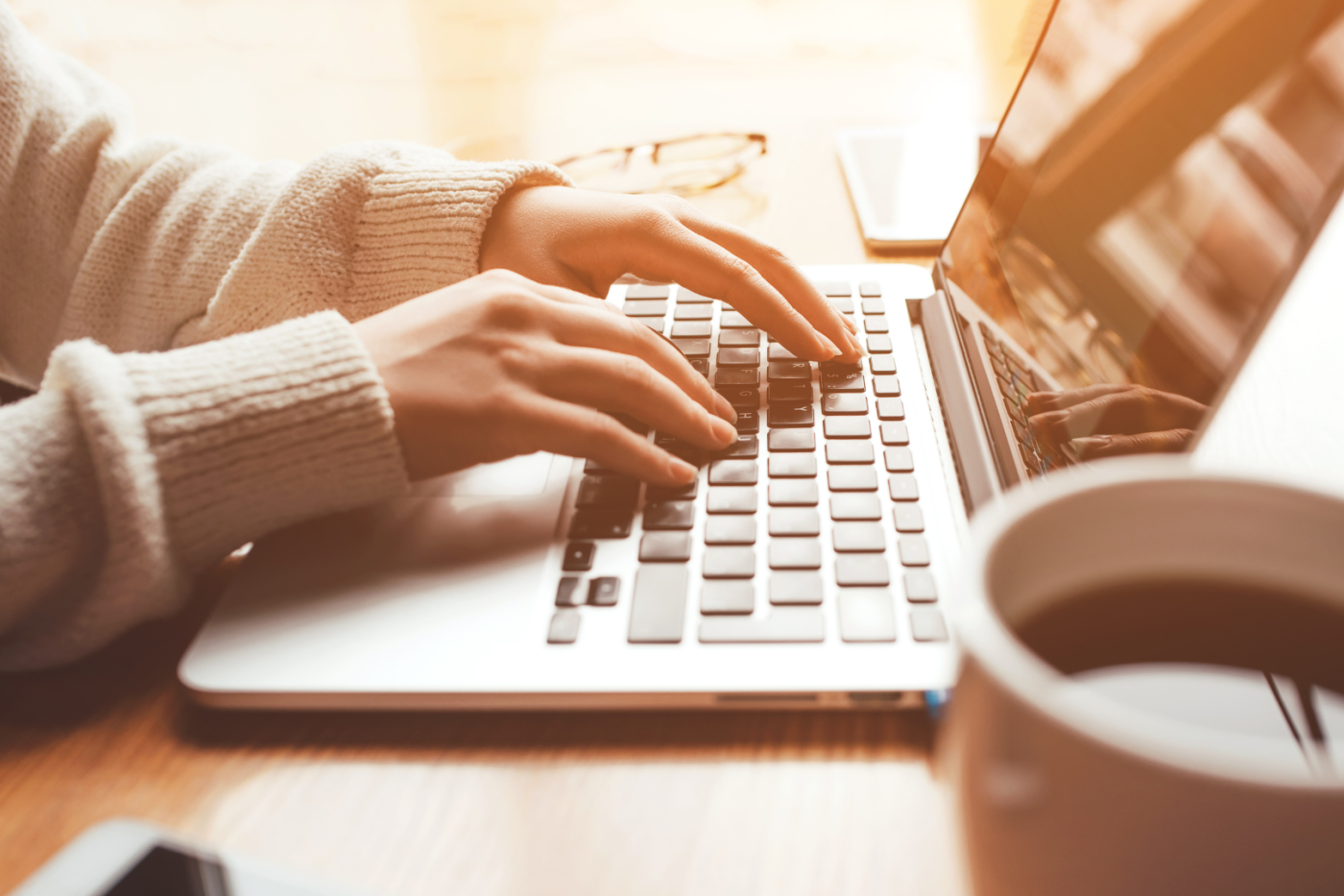 Person typing on laptop
